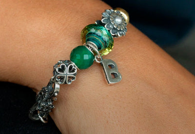 Trollbeads bracelet with a b letter tassel, green glass and gemstones with silver beads and pearl